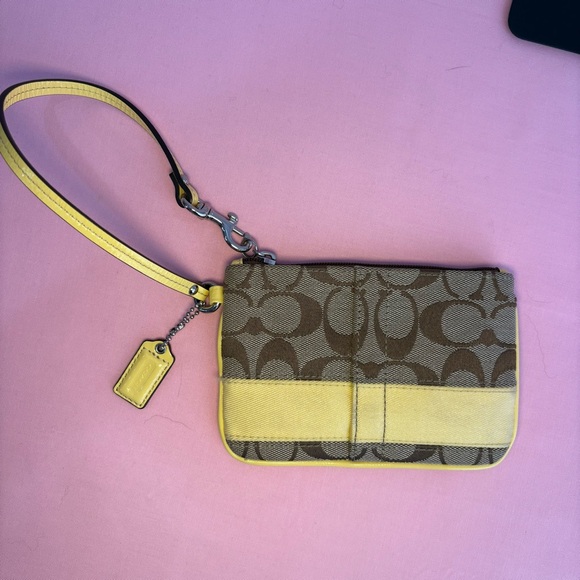 Coach Handbags - Coach Brown and Yellow Signature Wristlet EUC